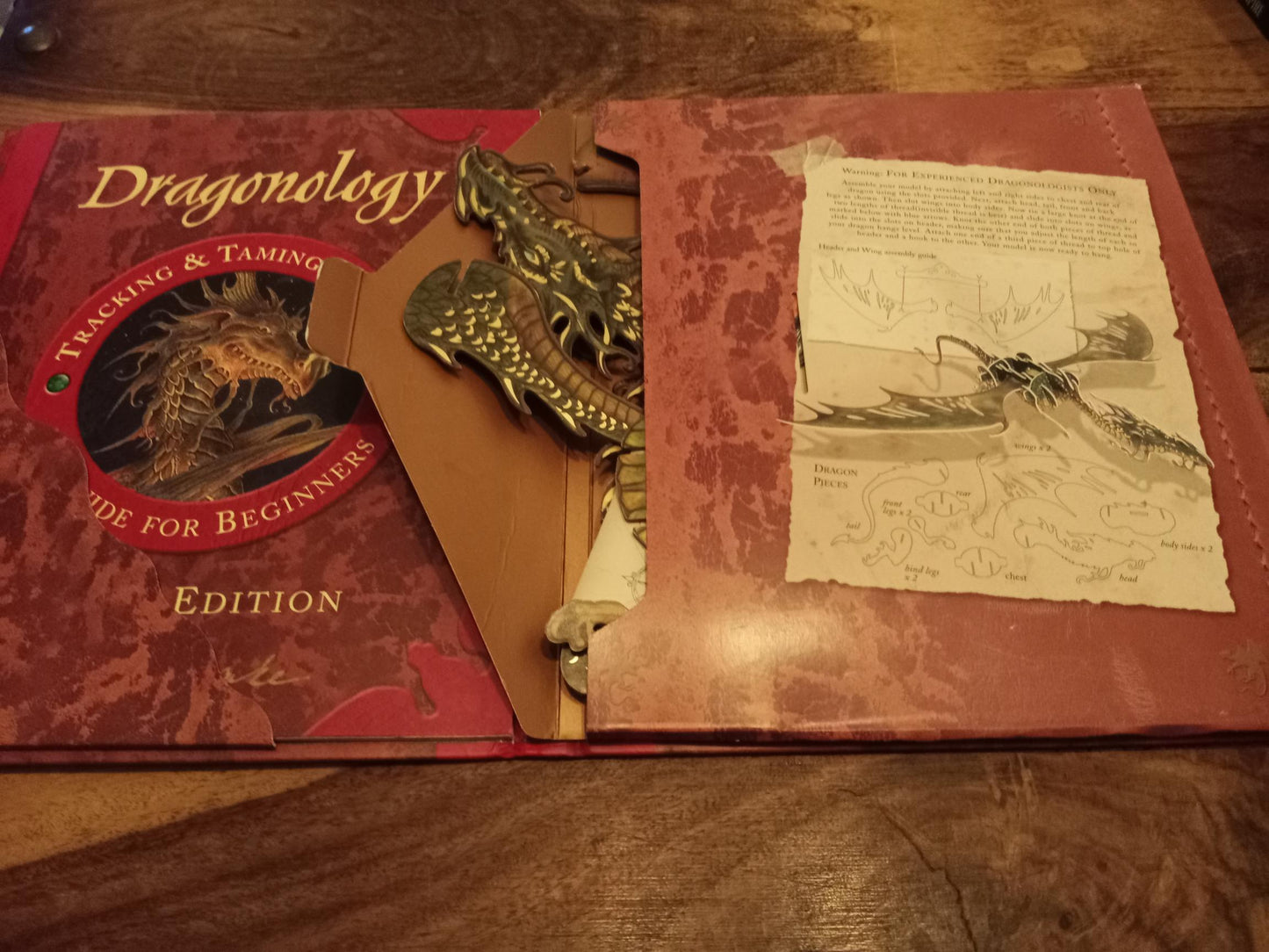 Dragonology Tracking and Taming Dragons by Ernest Drake.