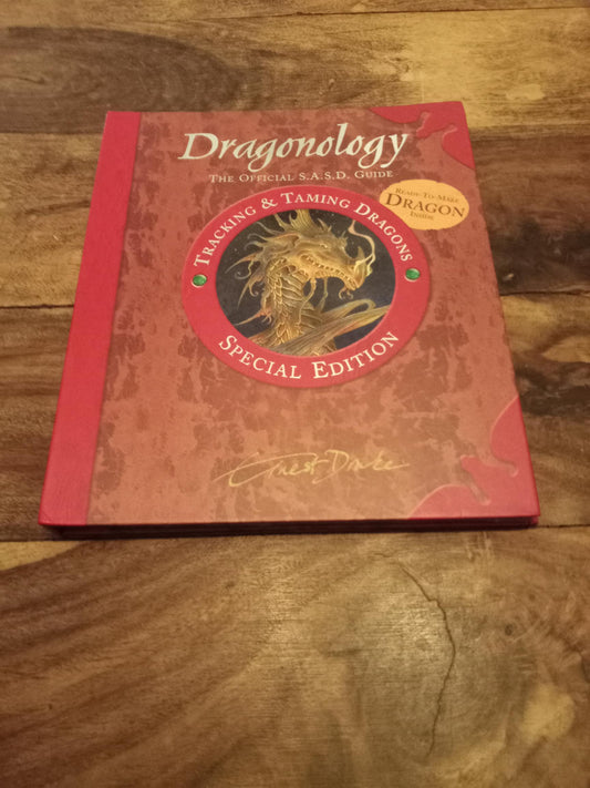 Dragonology Tracking and Taming Dragons by Ernest Drake.