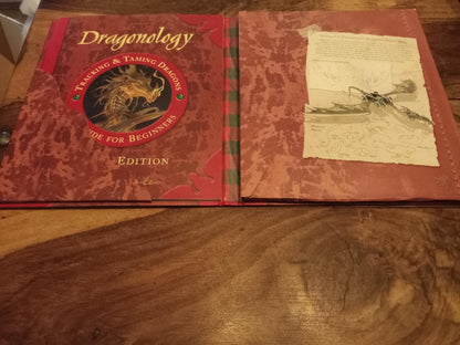 Dragonology Tracking and Taming Dragons by Ernest Drake.